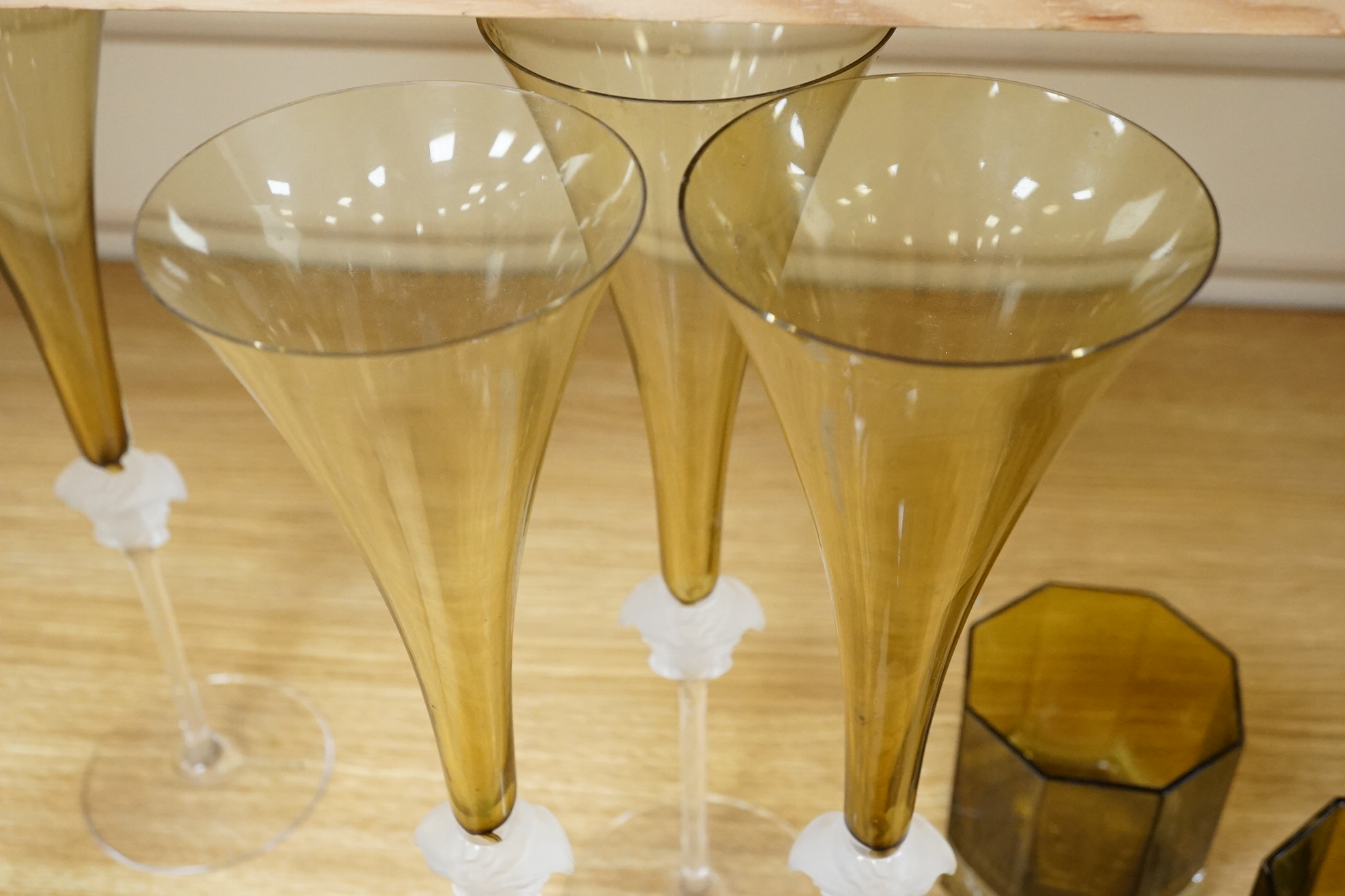 Five Versace Medusa Lumiere green champagne flutes and two similar tumblers, flutes 30cm high